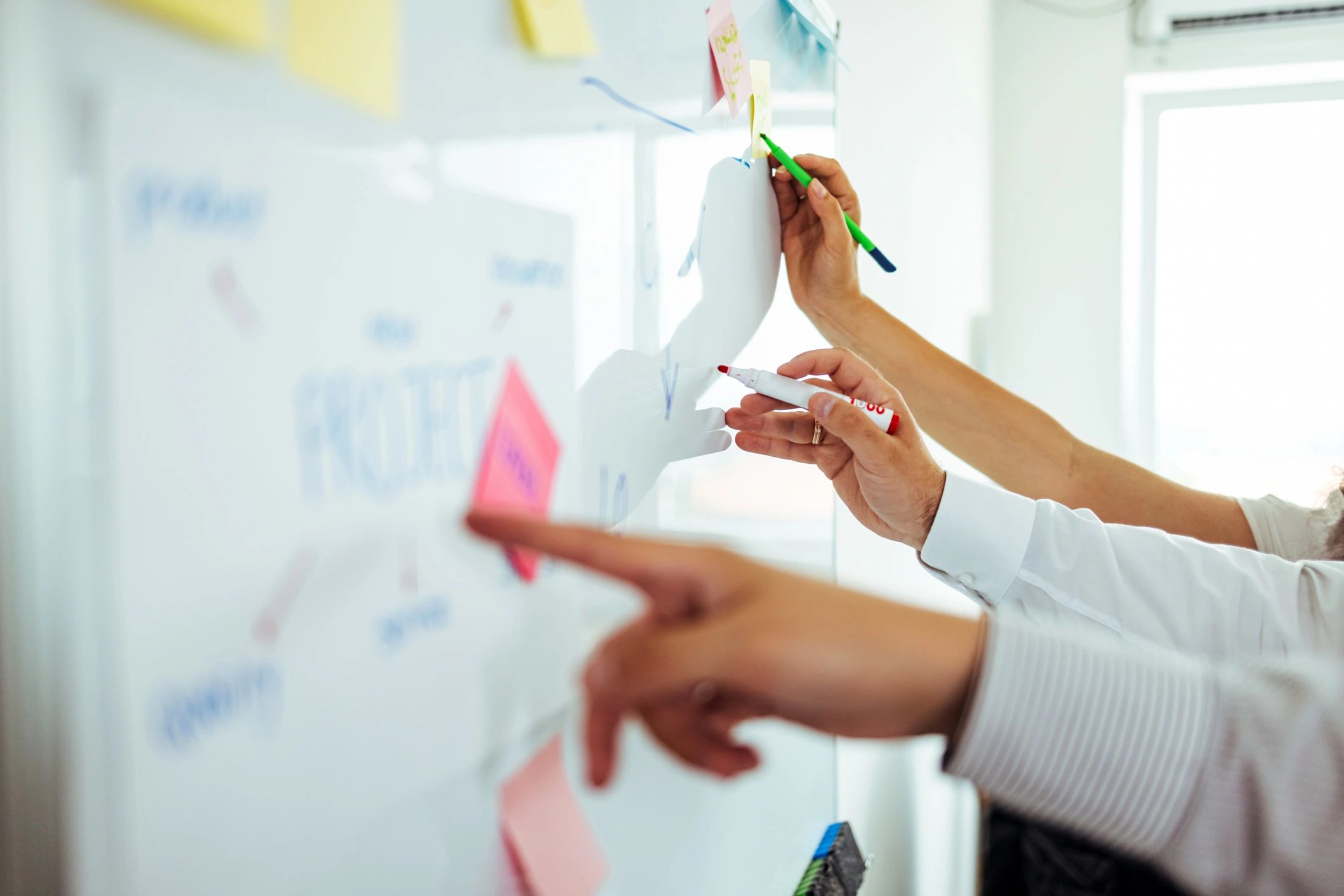 Strategy workshop planning session at a whiteboard