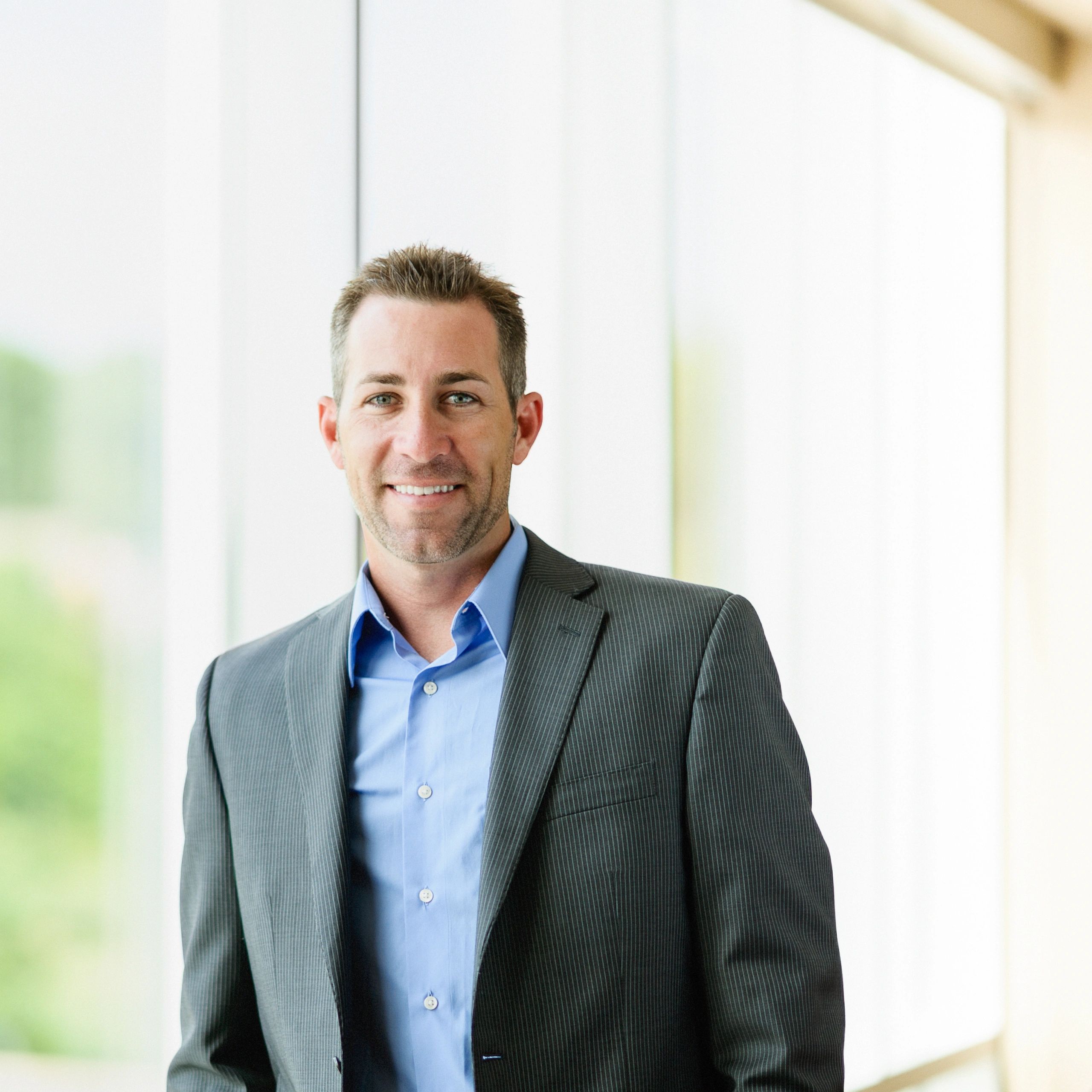 Professional headshot of a business executive